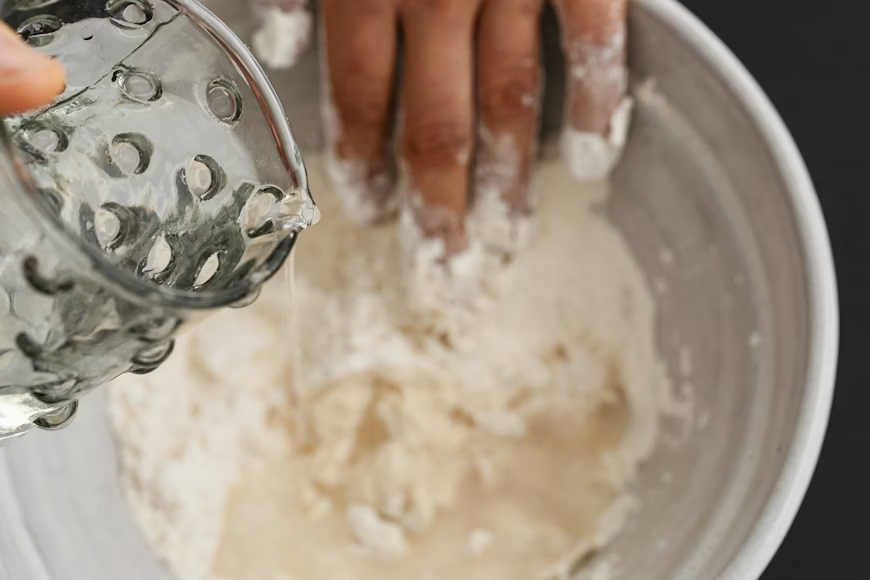 Baking soda paste in a small bowl used as a home remedy for spider bites